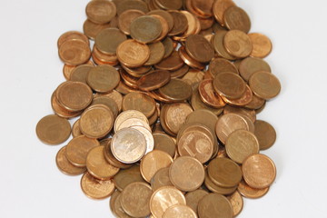 cents, cents of euro, money, mountains of cent coins, copper color on white background.