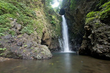 Waterfall in green rainforest. Triple waterfall Sekumpul in the mountain jungle. Bali,Indonesia. Travel concept.