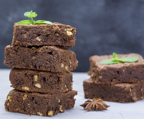 pieces of chocolate brownie pie with walnuts