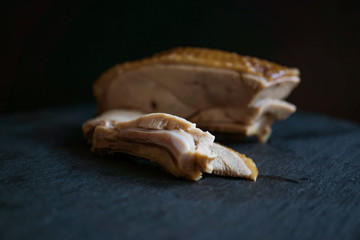 blur sliced of roasted duck meats in black background