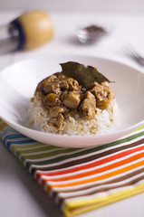 chicken and pork adobo over yellow rice, filipino food