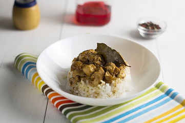 chicken and pork adobo over yellow rice, filipino food