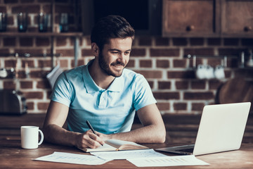Obraz premium Handsome Businessman Working with Laptop Home