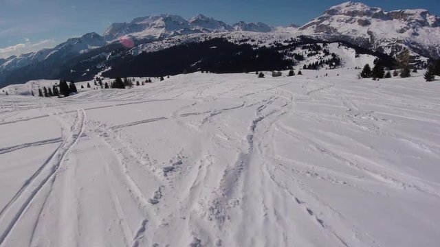 Winter holidays, man skiing in mountains, action camera footage