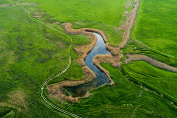 A beautiful view of the forest, fields and river from above. Drone photography of the city