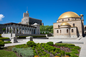Obraz premium Fortress Rabat in Georgia. Mosque with gold dome, gallery of Moorish and garden in sunny day