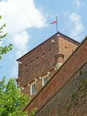 Wawel Royal Castle, Krakow, Poland. Thieves Tower with the flag of Poland on the top.