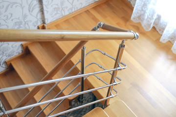 Modern wooden staircase in the house. The view from the top.