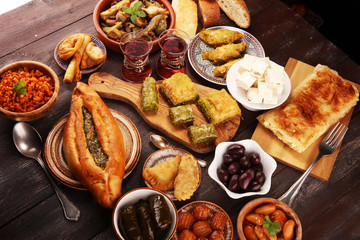 Middle eastern or arabic dishes and assorted meze, concrete rustic background. sambusak. Turkish...