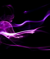 Purple smoke on black background