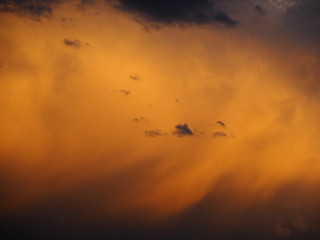 A cloud lit by the setting sun during the rain