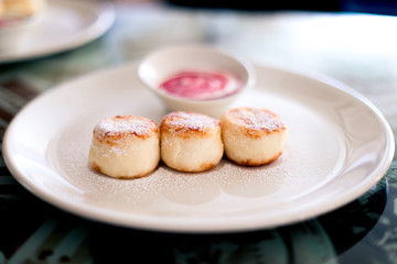 Russian syrniki or sirniki, cottage cheese pancakes