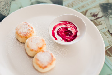 Syrniki on the white palte