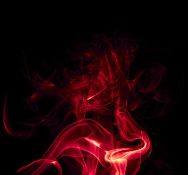 Red smoke on black background