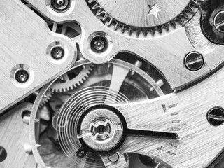 mechanism of old watch in black and white