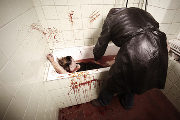 Woman stabbed and murdered by male intruder in lether coat