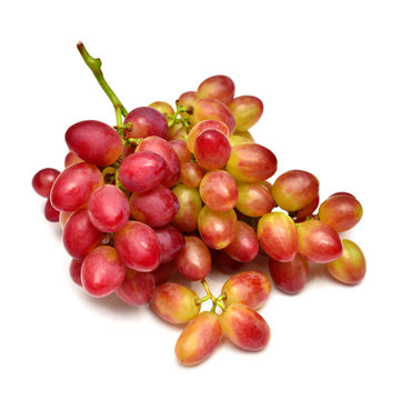 Fresh red grapes branch isolated on white background. Creative concept of fruit. Flat lay, top view. Pink bunch