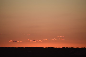 dramatic orange sunset on top of a mountain