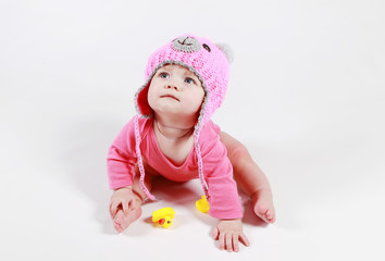 little girl is played with dents in the studio on a white background