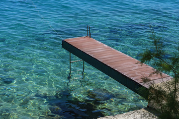 A small pier for boats on the sea coast.