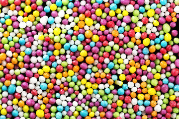 Fototapeta na wymiar Colorful eatable sugar pearls for food decoration