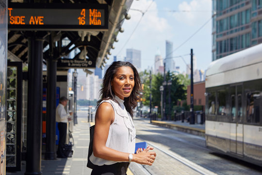 Businesswoman on train station platform