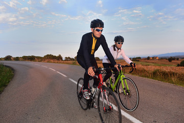 Fototapeta na wymiar cycling couple on a road