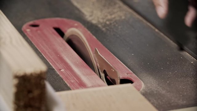 Cutting wooden plank by electric circular saw in 4k