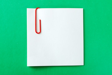 a recording sheet with a red paper clip