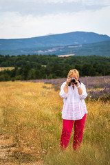 Woman Tourist Taking Photo Near the Lavender Fields in Provence