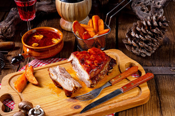 spicy roasted meat with mushroom sauce in the oven