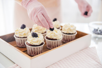 a concept of baking sweet cupcakes and muffins at home