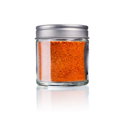 piment d´espelet in a glas with metal lid, isolated on white