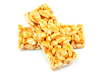Peeled peanuts in caramel.Candy bar isolated.