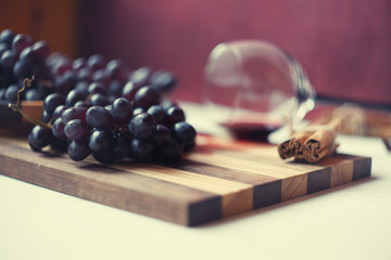 blue grapes and vine in the glass