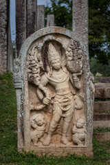 Fototapeta na wymiar Guardstone Decorative stone placed in front of ancient buddhist buildings. Located in Anuradhapura, Sri Lanka.