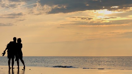 Couple in front of sunset 