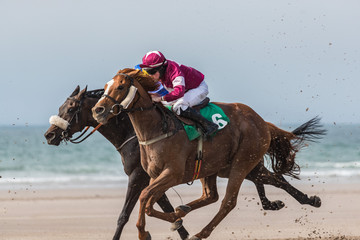 Horse racing on the beach,  the wild atlantic way on the west coast of Ireland