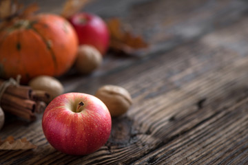Autumn apples, pumpkin and cinnamon sticks