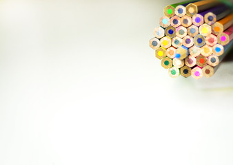 group of color pencils against white background for education concept