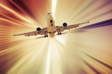 Airplane taking up on sunbeams background