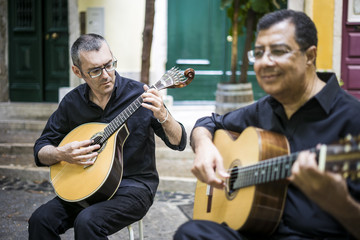 Two fado guitarists with acoustic and portuguese guitars - obrazy, fototapety, plakaty
