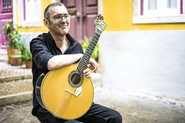 Musician with his beloved unique portuguese guitar, Portugal