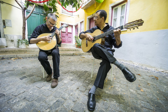 Two fado guitarists with acoustic and portuguese guitars