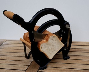 close-up of a vintage danish bread slicer with a danish white bread
