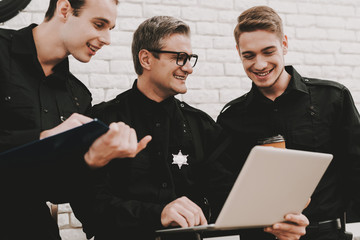 Officer Instructs Subordinates In Police Station.