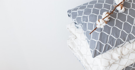 Two bedding sets in grey and beige, cool for two children, for siblings. Modern bed linen, in trend, minimalism clean home concept