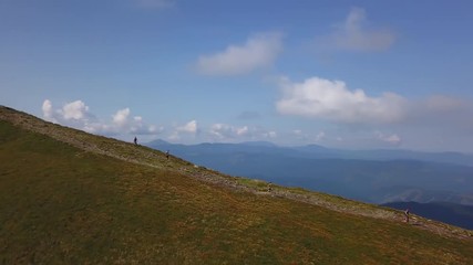 View of runners descend from the Pop Ivan hill in the Carpathians drone footage