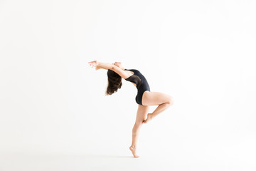 Fototapeta premium Ballerina Dances Energetically And Gracefully On White Background
