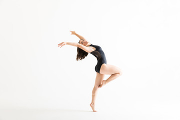 Naklejka premium Woman In Ballet Costume Dancing Over White Background